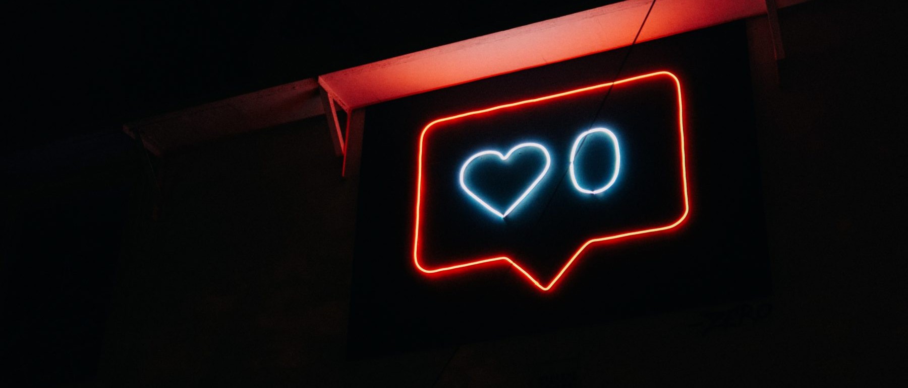 stock image of neon sign representing social media