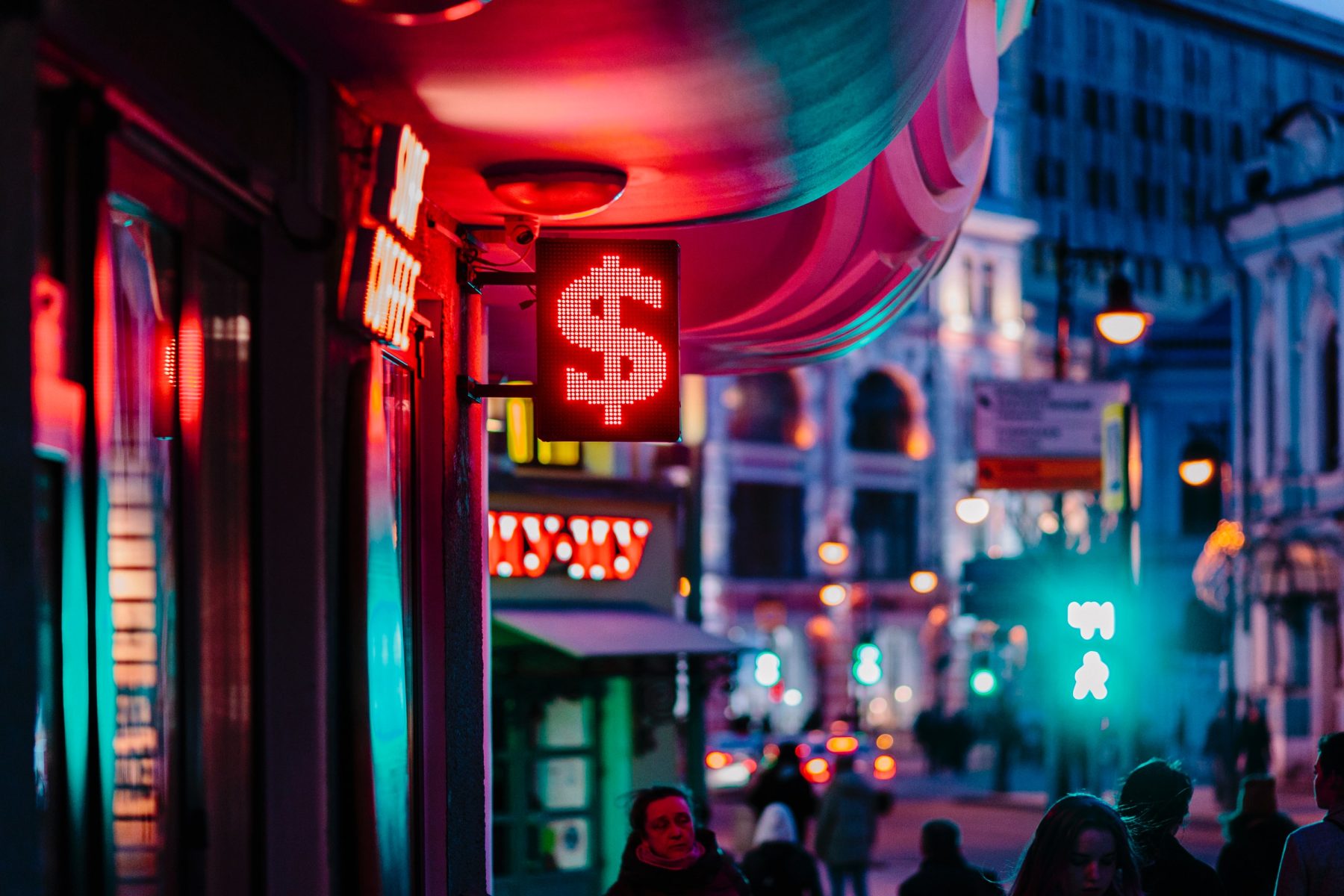 Stock image of street with neon dollar pricing sign